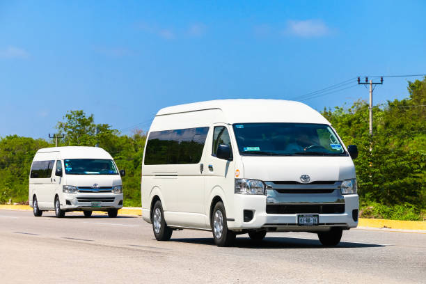 QUINTANA ROO, MEXICO - MAY 16, 2017: Passenger vans Toyota HiAce at the interurban road.